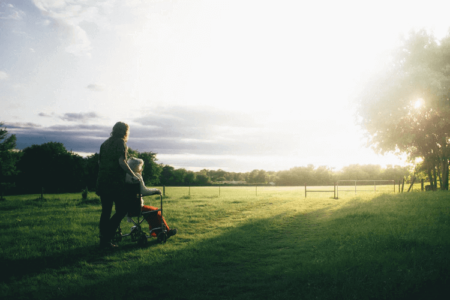 outside, sunshine, elderly, wheelchair, caregiver, caregiving, assistance, grass